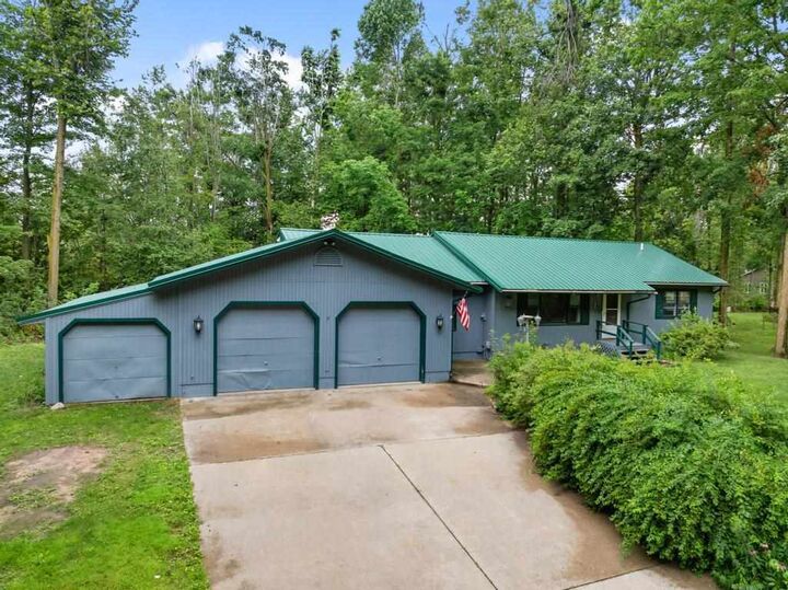 Property Photo: 1145 Woodland Dr MI 49770