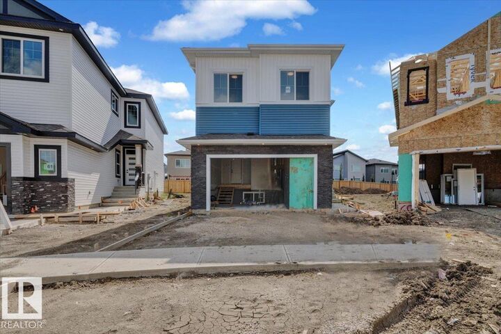 Property Photo:  65 Blackbird Bend  AB T8L 0G6 