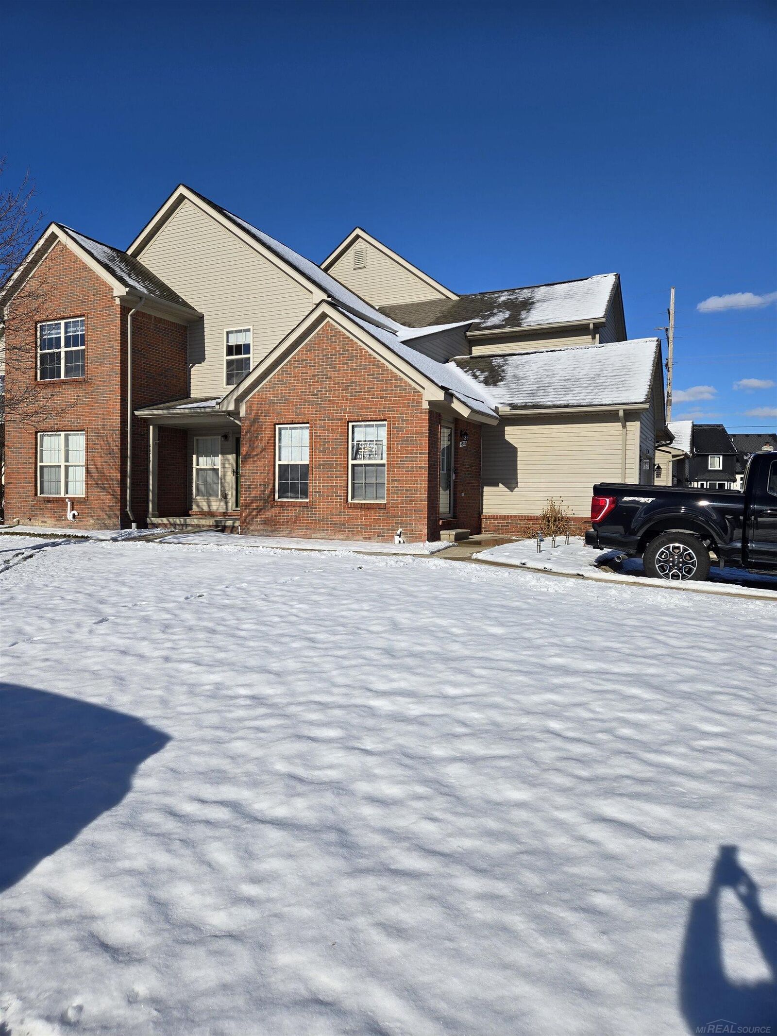 Property Photo:  48713 Chelmsford Court  MI 48047 