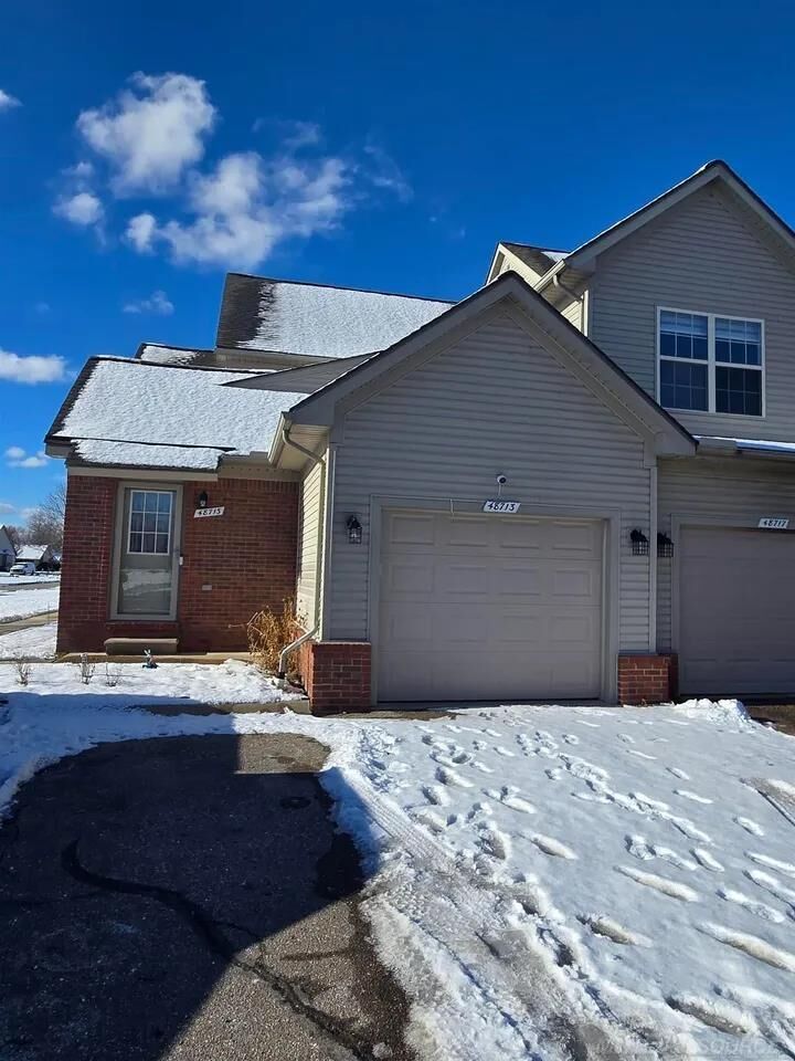 Property Photo:  48713 Chelmsford Court  MI 48047 