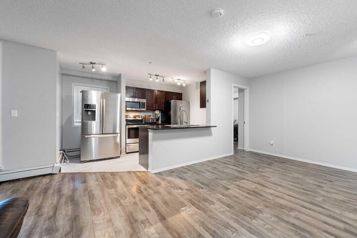 Property Photo: 15 Saddlestone Way NE 102 AB T3J 0S3