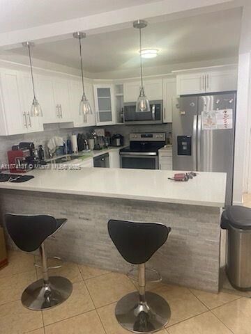 Property Photo: 6990 NW 186th St 4-409 FL 33015