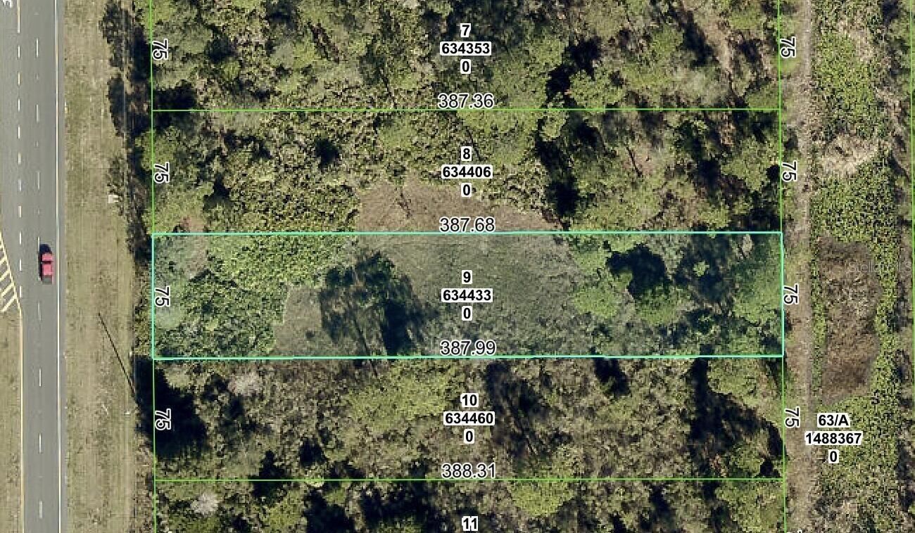 Property Photo:  Lot 9 Commercial Way  FL 34614 
