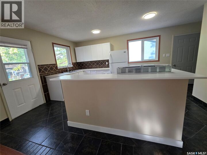 Property Photo:  1200 Dahl Street E  SK S9H 3Z3 