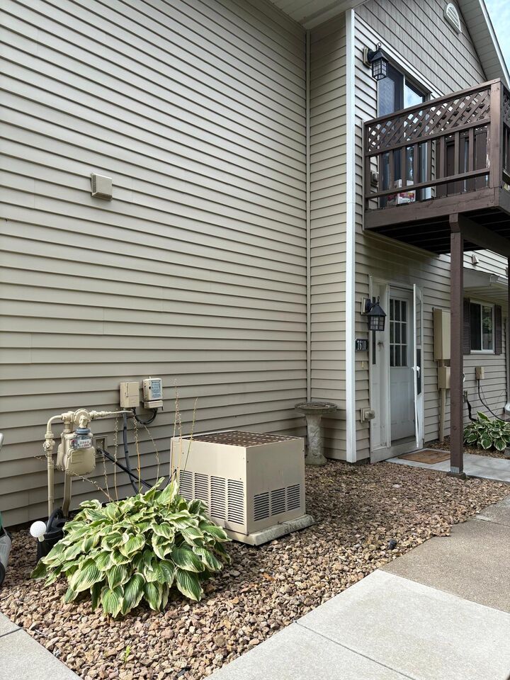 Property Photo:  7610 15th Street Lane N 907  MN 55128 