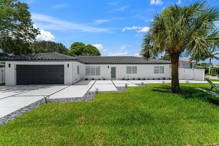 Property Photo:  699 NE 70th St  FL 33487 