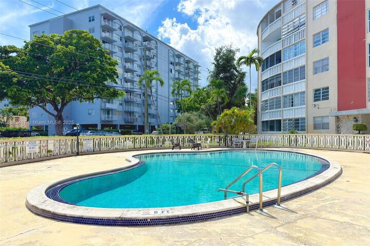 Property Photo:  1475 NE 125th Ter 408H  FL 33161 