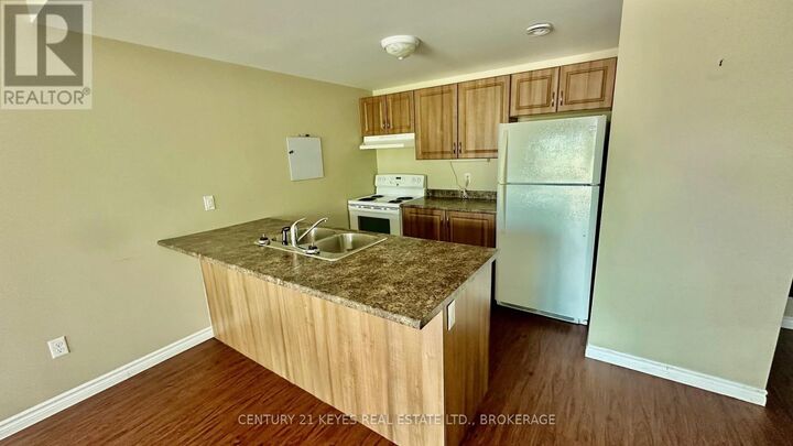 Property Photo:  665 King Street West 208  ON K7G 2H3 