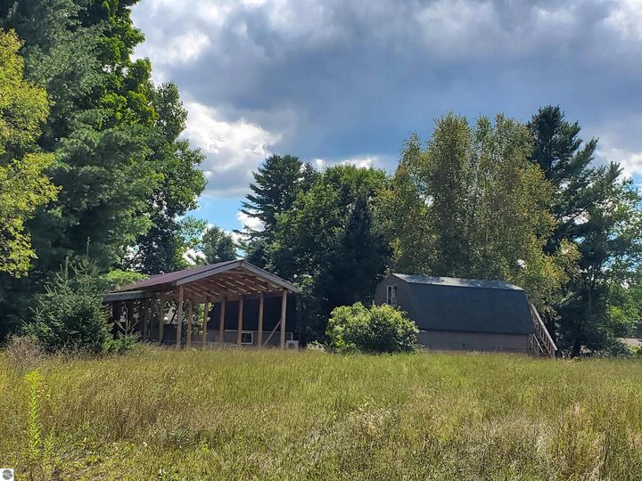 Property Photo:  1167 S Taxiway Hotel  MI 49651 