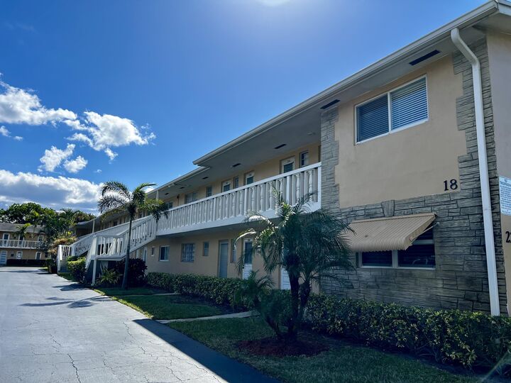 Property Photo:  2222 NE 1st Way 103  FL 33435 