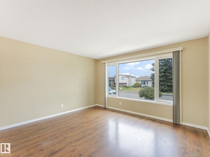 Property Photo:  13547 24 Street NW  AB T5A 3S7