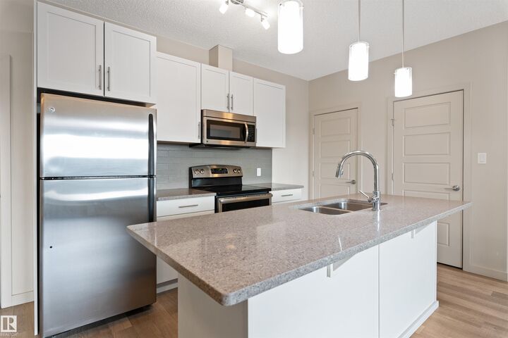 Property Photo: 1144 Adamson Drive SW 416 AB T6W 2X7
