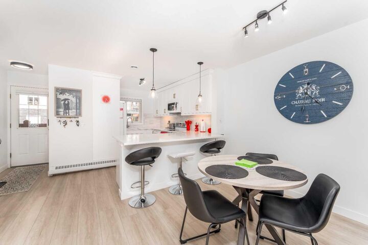 Property Photo: 112 Kananaskis Way 205 AB T1W 2X2