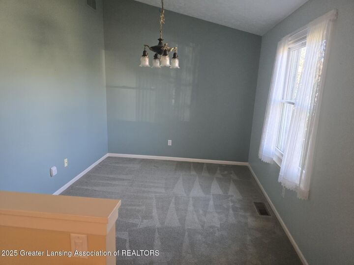 Property Photo:  451 Red Cedar Boulevard  MI 48895 