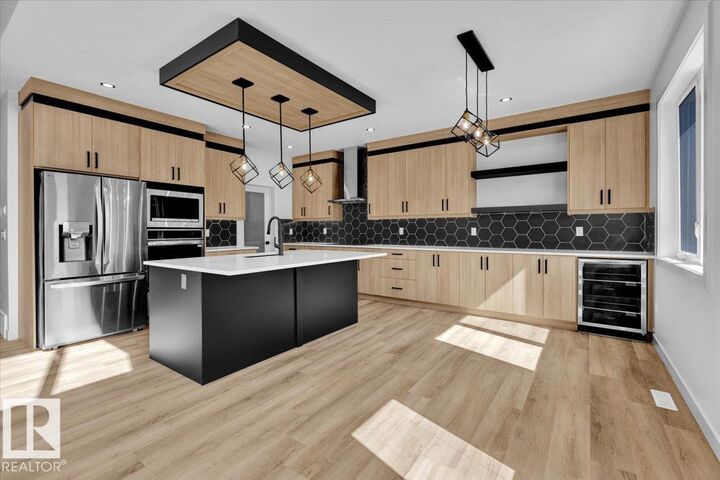 Property Photo: 1119 Gyrfalcon Crescent NW AB T5S 0S5