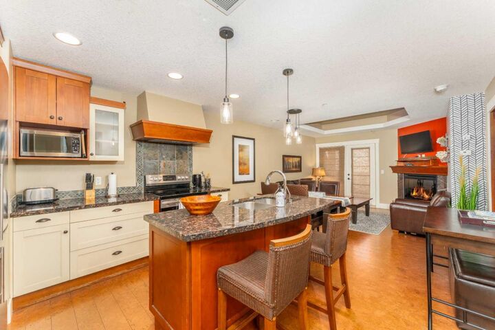 Property Photo: 173 Kananaskis Way 323 AB T1W 0A3