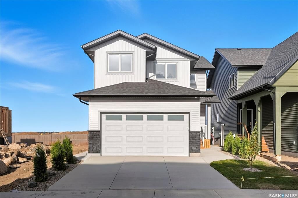 Property Photo:  311 Sharma Crescent  SK S7W 1L1 