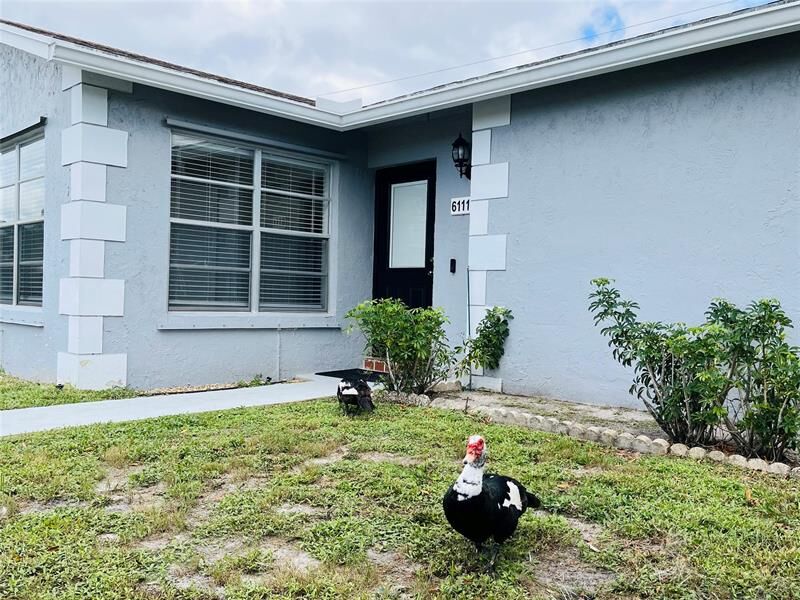 Property Photo:  6111 Rainbow Circle  FL 33463