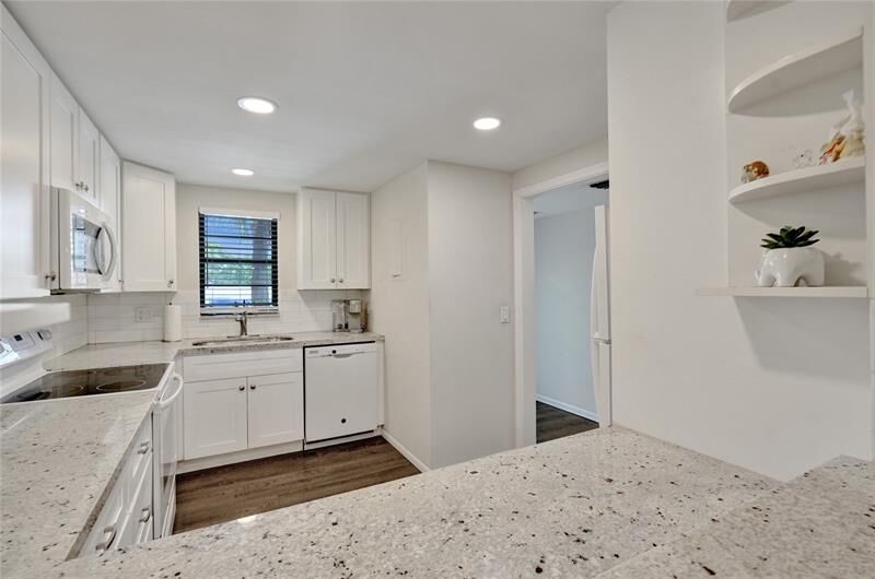 Property Photo:  2410 Deer Creek Country Club Blvd 202  FL 33442 