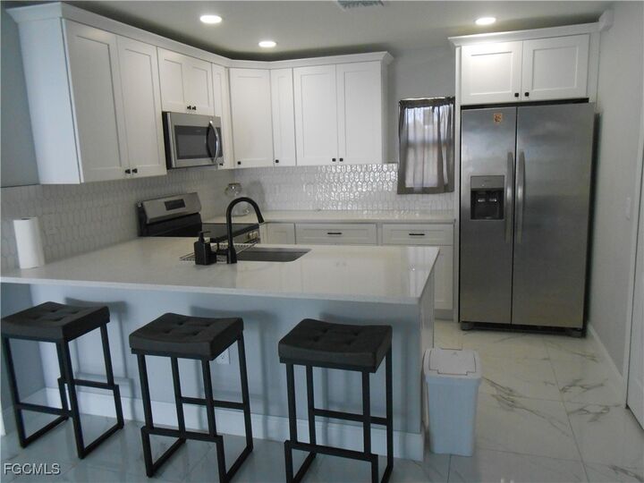 Property Photo:  636 Eisenhower Boulevard  FL 33974 