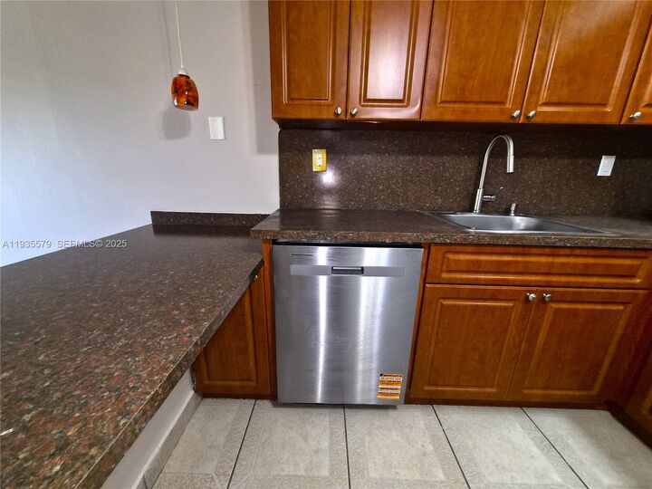 Property Photo:  8811 SW 132nd Pl 203cw  FL 33186 