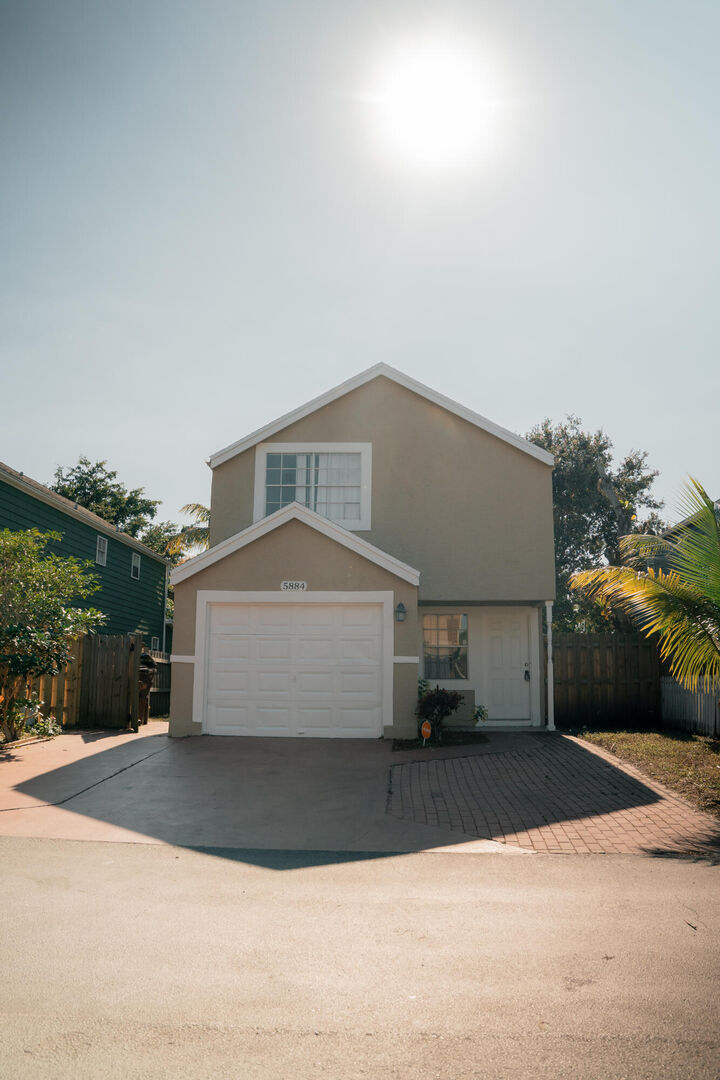 Property Photo: 5884 Dewberry Way FL 33415