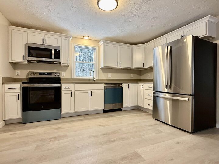 Property Photo:  69 Kullgren Road  NH 03084 