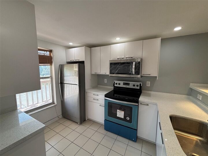 Property Photo:  6000 NW 64th Avenue 211  FL 33319 