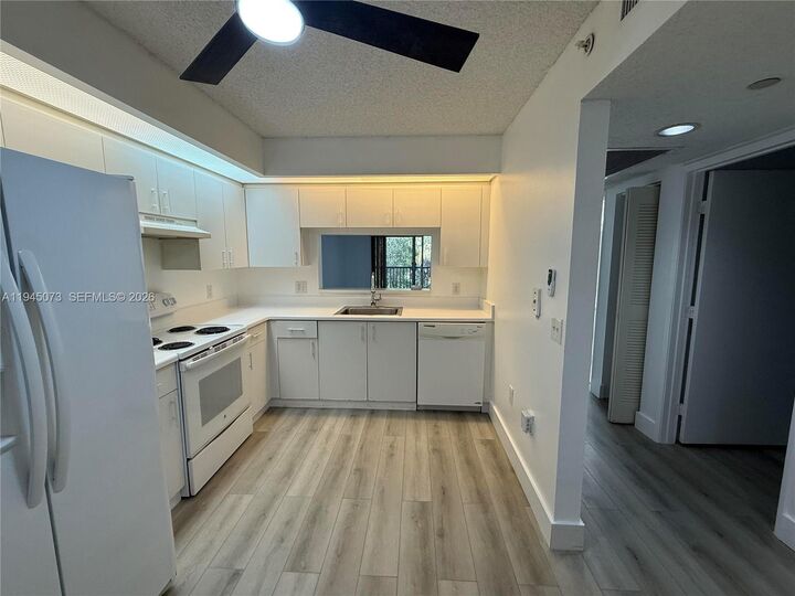 Property Photo:  900 SW 142nd Ave 305L  FL 33027 