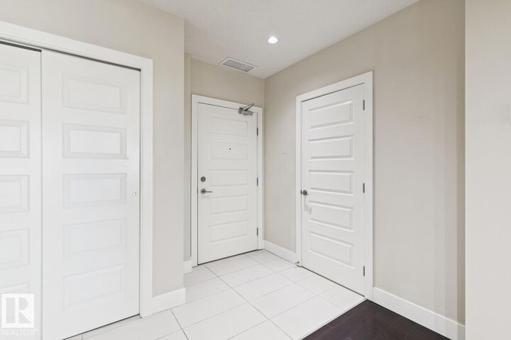 Property Photo: 1350 Windermere Way SW 208 AB T6W 2J3