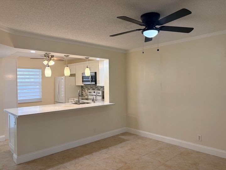 Property Photo:  911 Gardenia Drive E 150  FL 33483 