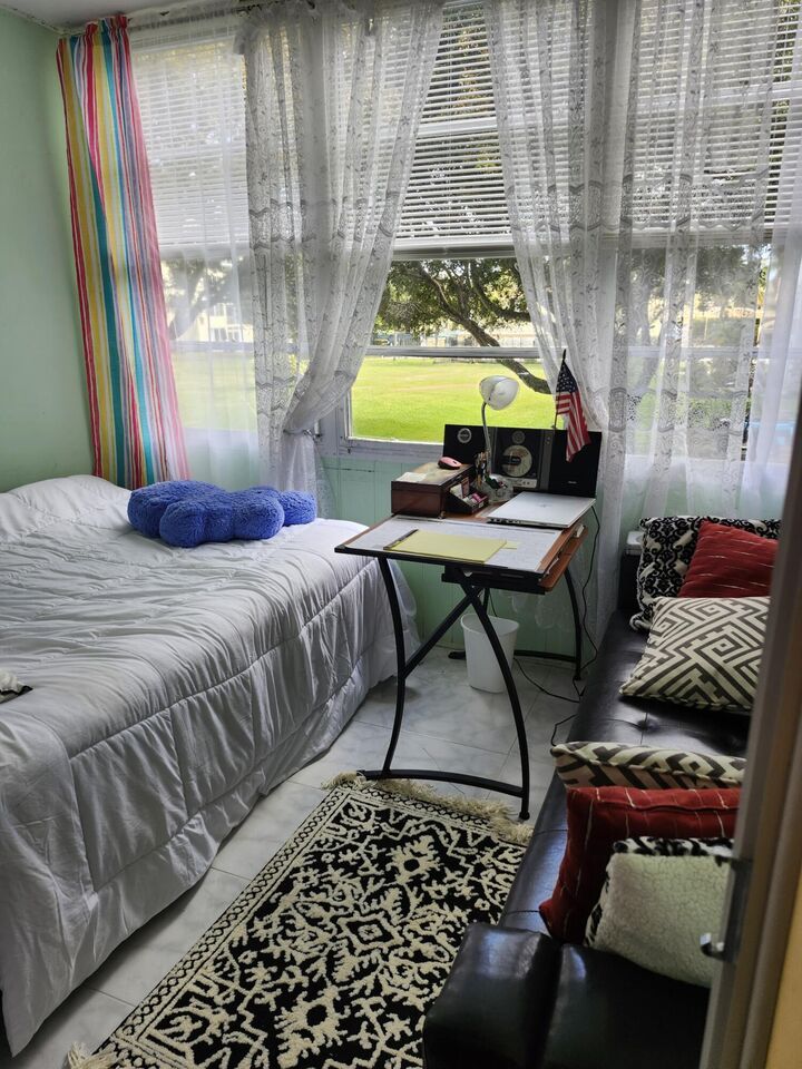 Property Photo:  2400 NE 1st Lane 206  FL 33435 