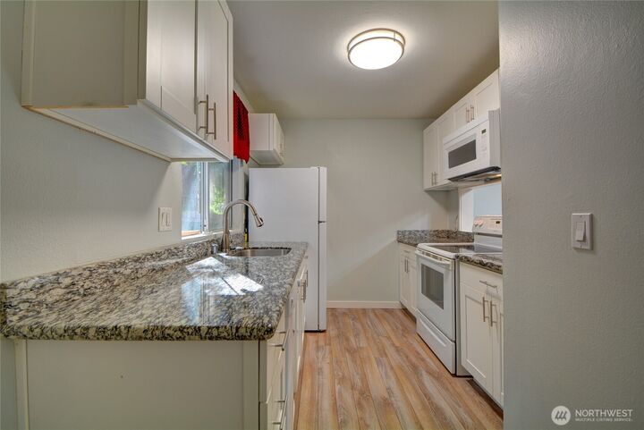 Property Photo:  4807  180th Street SW E105  WA 98037 