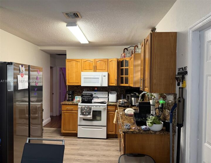 Property Photo:  550 NW 135th St  FL 33168 