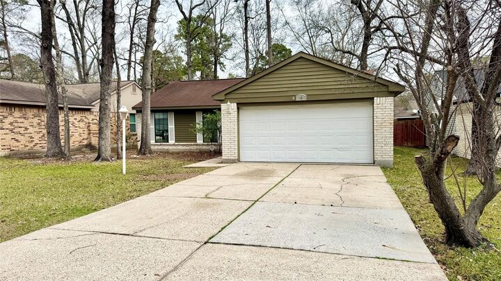 Property Photo:  18 Dellforest Court  TX 77381 