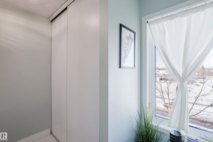 Property Photo:  8907 106A Avenue NW 310  AB T5H 3Y7 