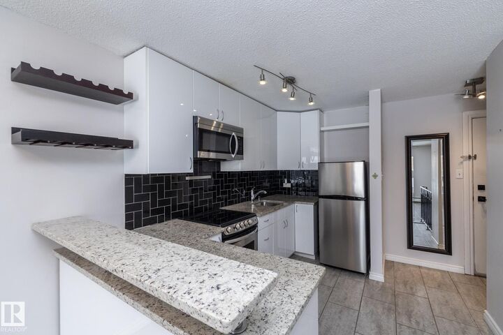 Property Photo:  11429 124 Street NW 104  AB T5M 0K4 