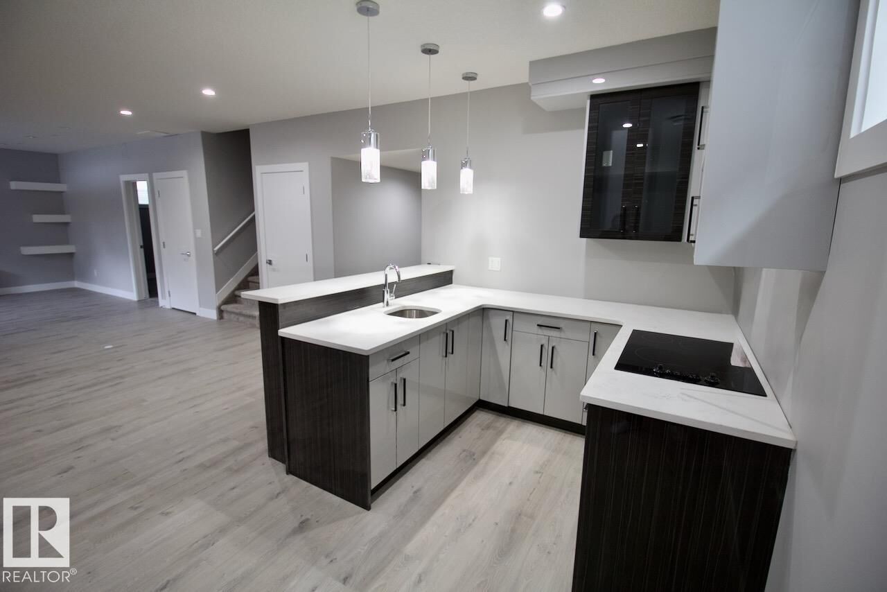 Property Photo: 1326 Hainstock Way SW Bsmt AB T6W 3B6