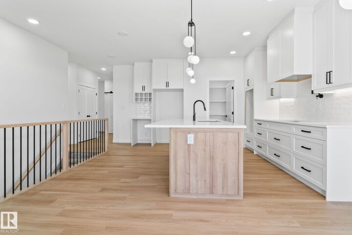 Property Photo: 1411 Redpoll Court NW AB T5S 0V4