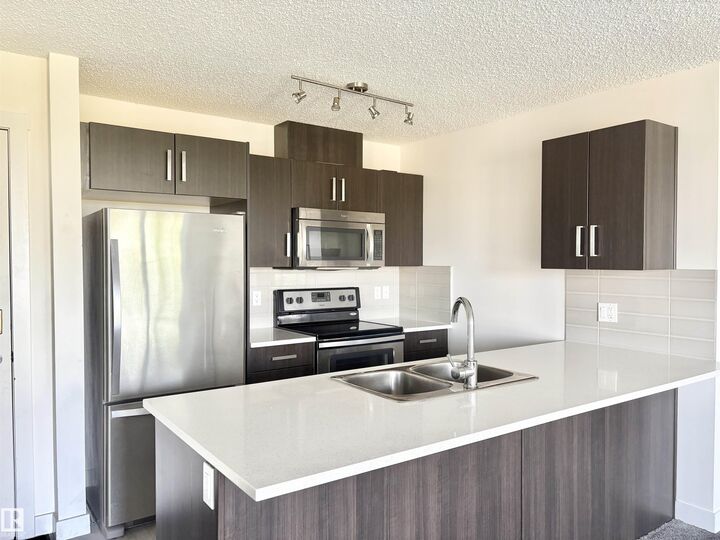Property Photo:  667 Watt Boulevard SW 312  AB T6X 0Y2 
