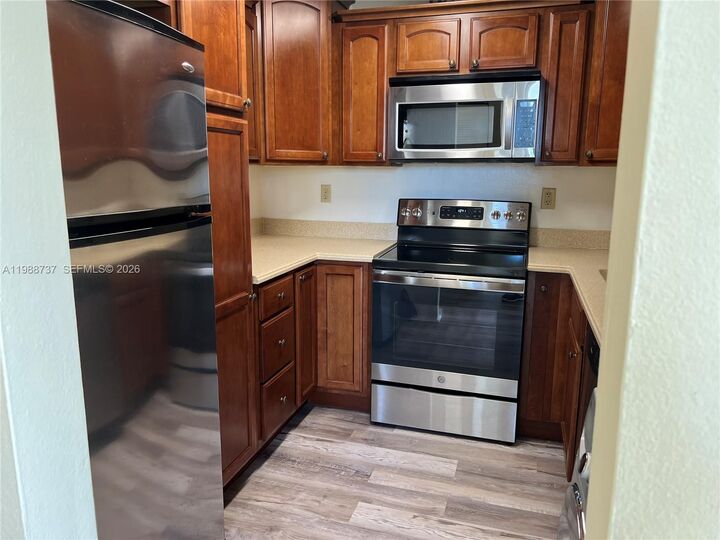 Property Photo:  13120 SW 92nd Ave B-406  FL 33176 