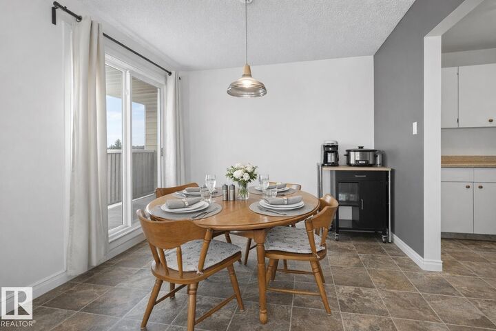 Property Photo: 5125 Riverbend Road NW 407 AB T6H 5K5