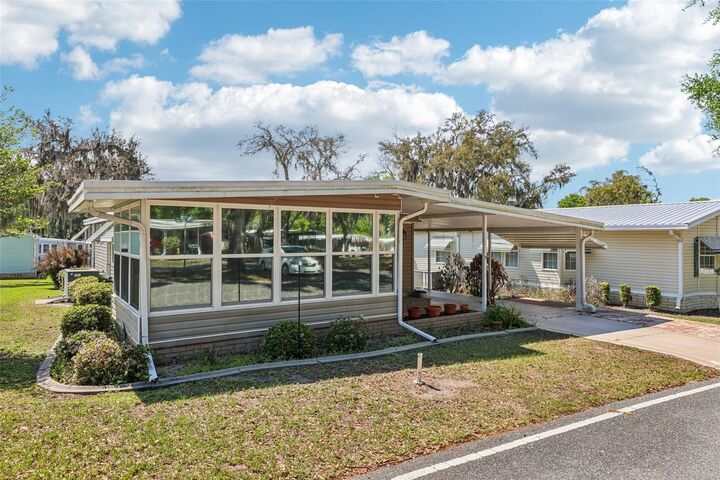 Property Photo: 105 Orchid Way FL 34748