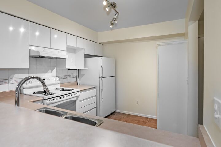 Property Photo: 1200 Eastwood Avenue 212 BC V3B 7R9