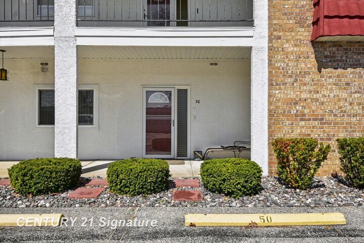 Property Photo:  9030 Greenway Boulevard D-50  MI 48609 