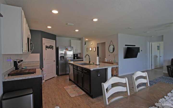 Property Photo:  9439 Lutoo Ln  FL 32526 
