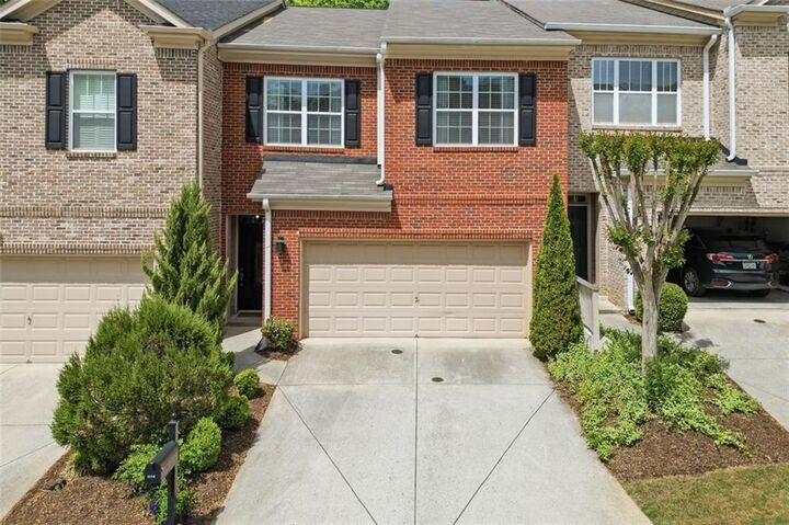 Property Photo:  1114 Firethorne Pass  GA 30040 