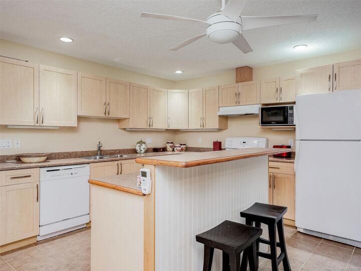 Property Photo: 9907 Galaran Rd BC V8L 4G5