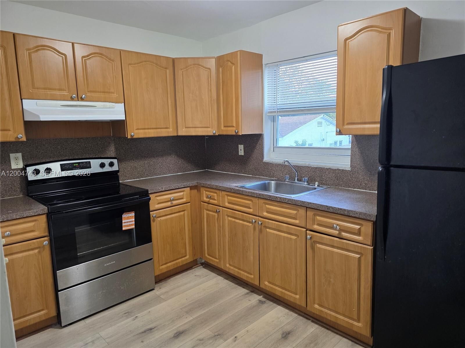 Property Photo:  1111 NW 19th Ave 205  FL 33125 