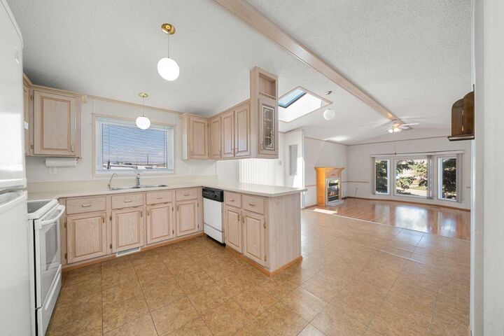 Property Photo:  99 Arbour Lake Road NW 299  AB T3G 4E4 